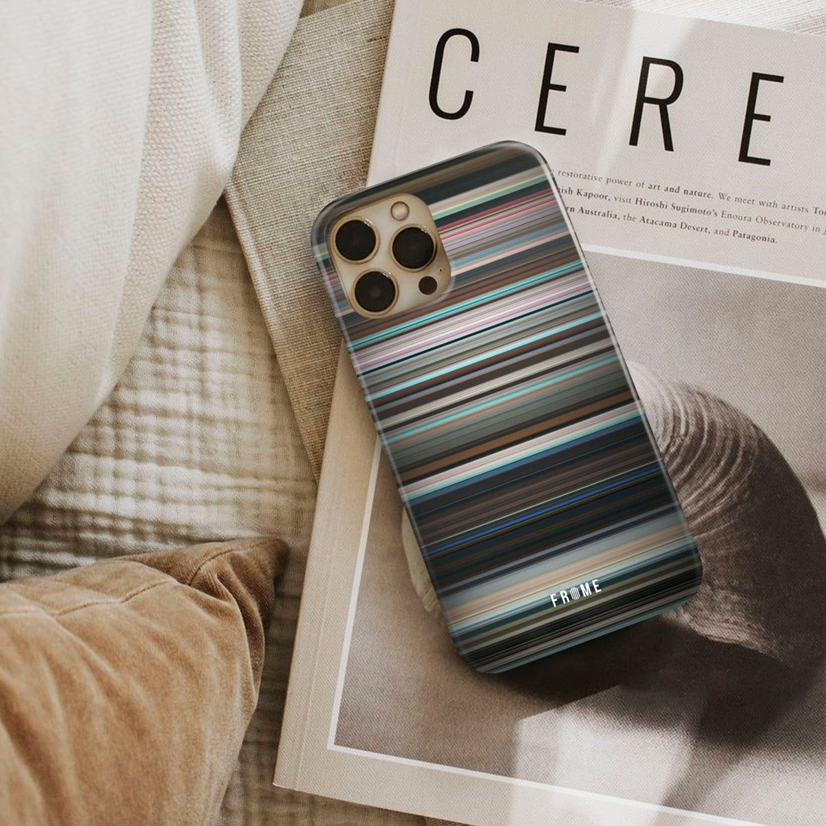 aftersun Frome phone case next to interior items