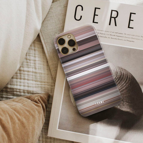 grease Frome phone case next to interior items