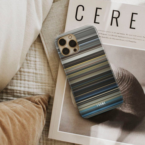 the giver Frome phone case next to interior items