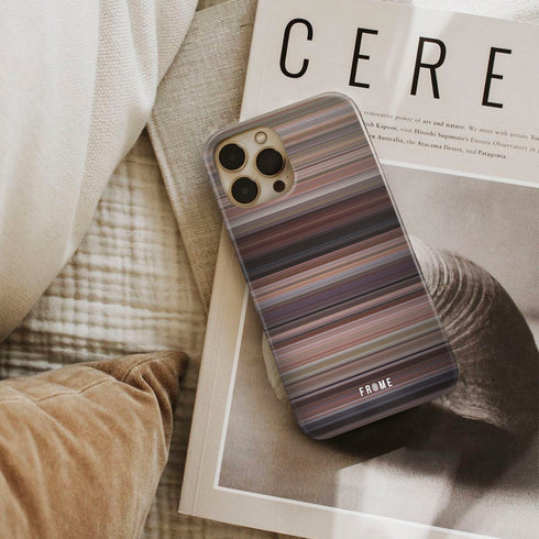 clueless Frome phone case next to interior items