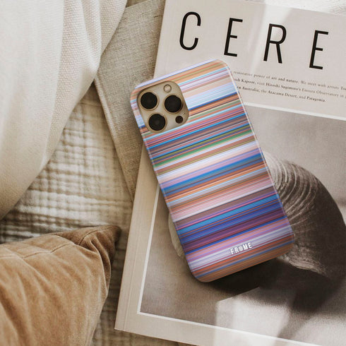 the grinch Frome phone case next to interior items