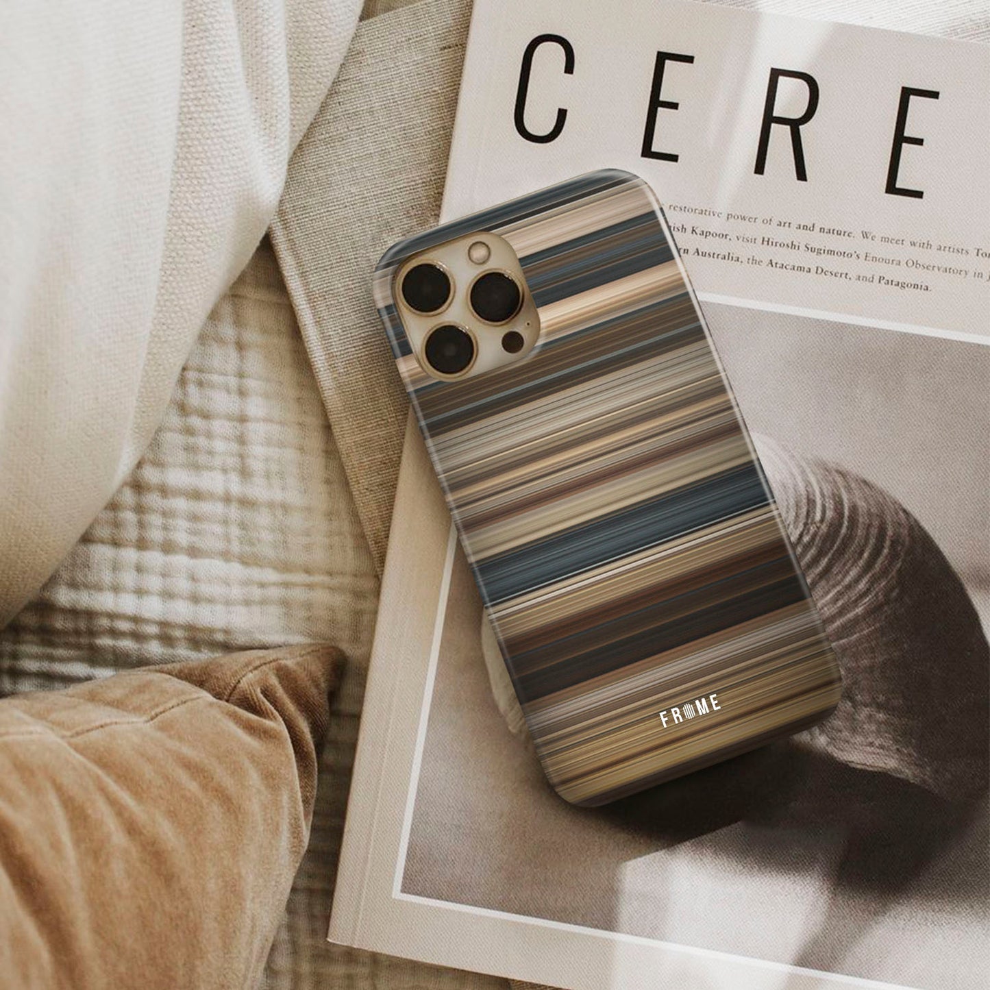 300 Frome phone case next to interior items