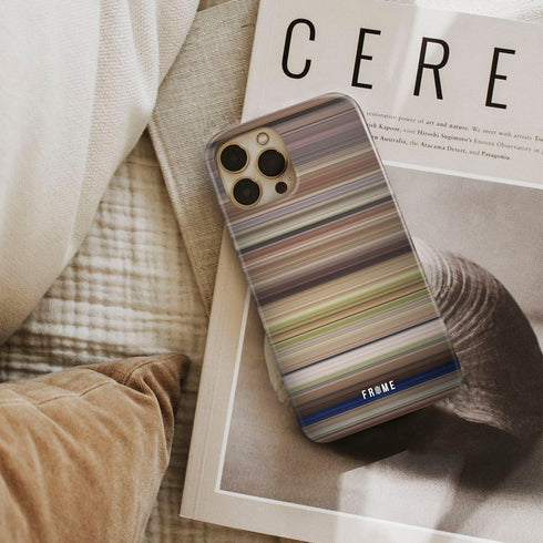 french kiss Frome phone case next to interior items