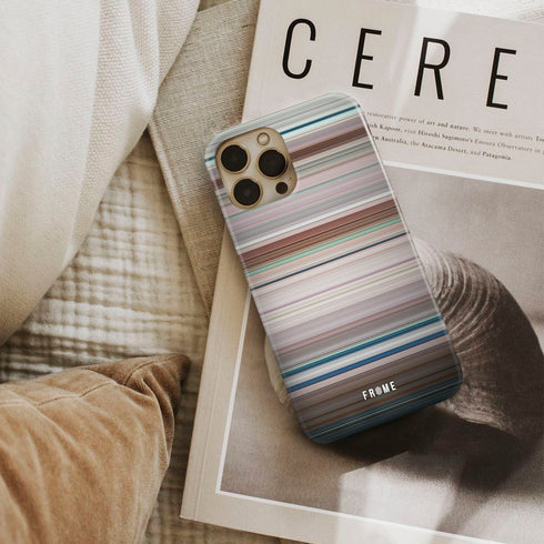 k-12 Frome phone case next to interior items