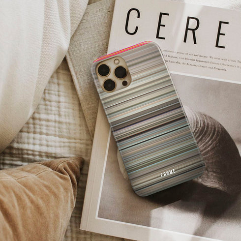 it's a mad, mad, mad, mad world Frome phone case next to interior items