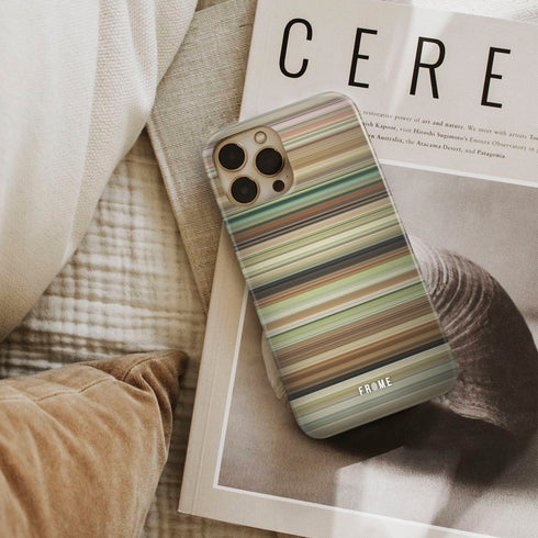 austenland Frome phone case next to interior items