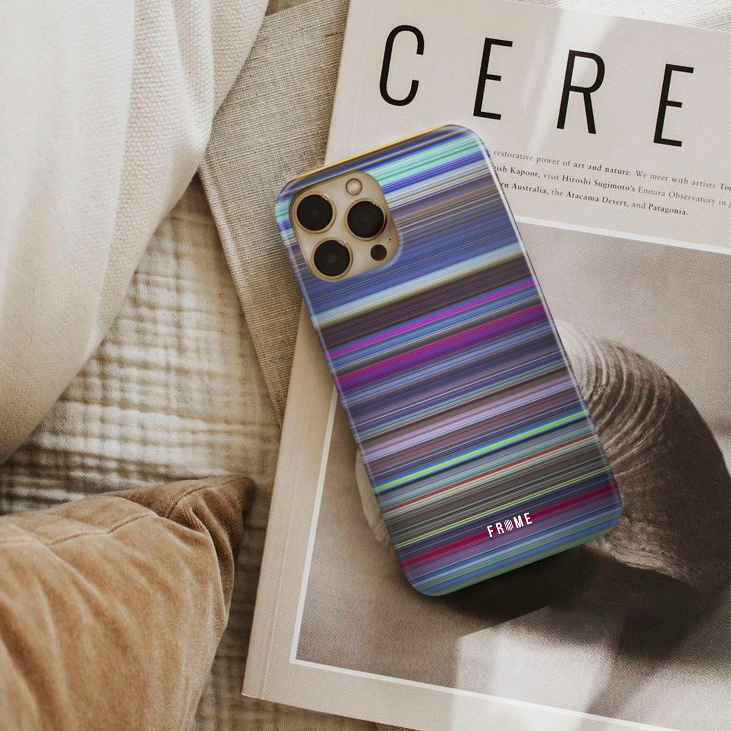 the last unicorn Frome phone case next to interior items