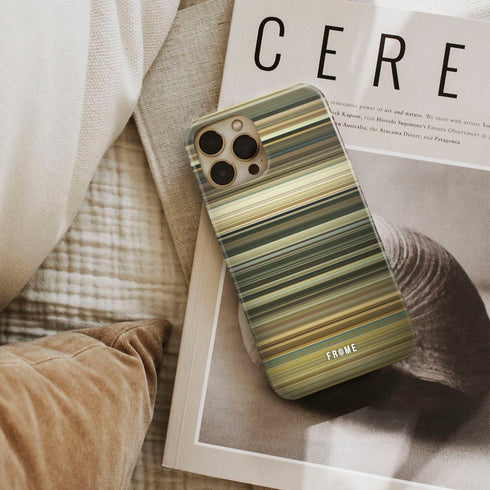 the good, the bad, and the ugly Frome phone case next to interior items