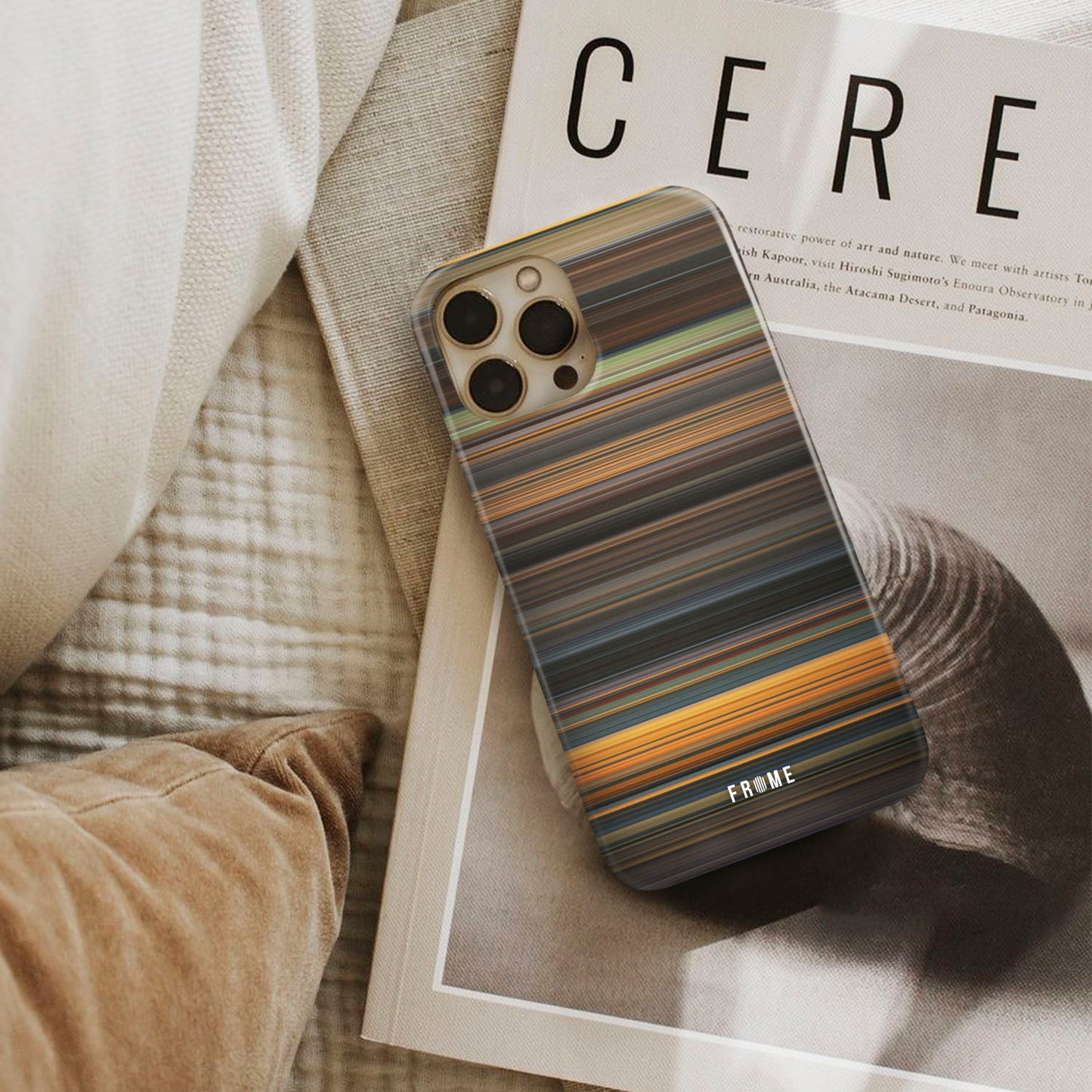 dune Frome phone case next to interior items