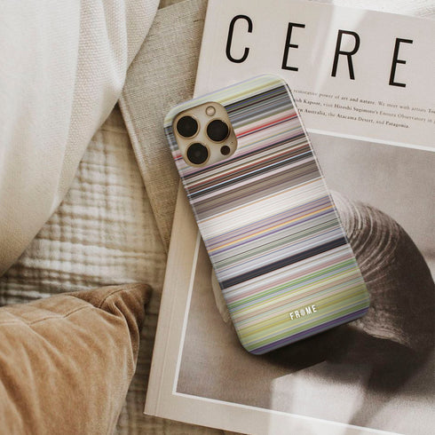 yellow submarine Frome phone case next to interior items