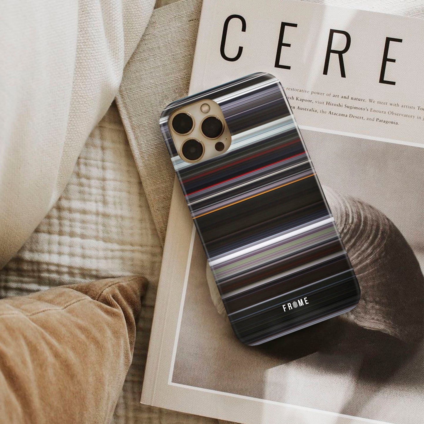 under the skin Frome phone case next to interior items