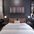 Bedroom interior with Black Is King Frome on the wall