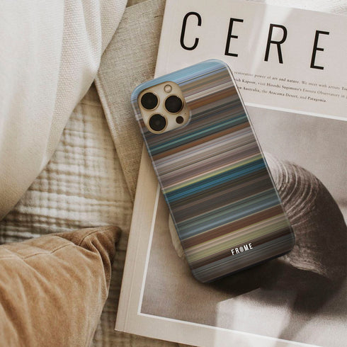 tag Frome phone case next to interior items