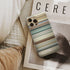 like stars on earth Frome phone case next to interior items