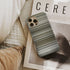 adele - rolling in the deep Frome phone case next to interior items