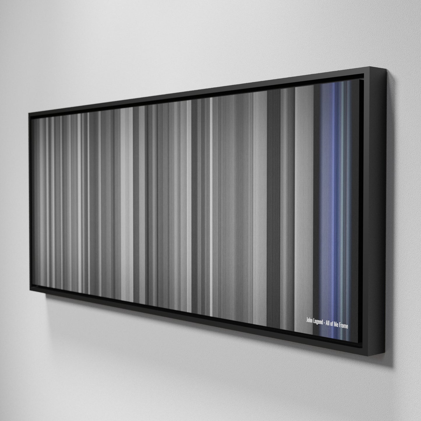 Side view of Framed Buff's of John Legend - All of Me Frome on the wall