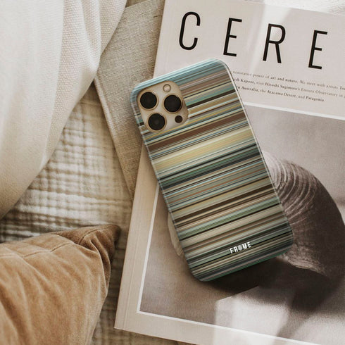 into the wild Frome phone case next to interior items