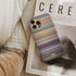 a scanner darkly Frome phone case next to interior items