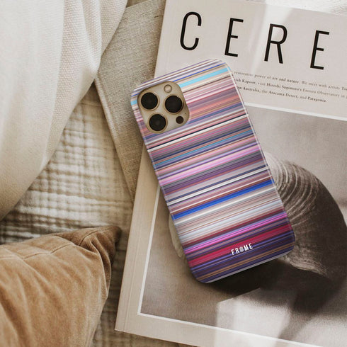 sing Frome phone case next to interior items