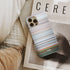 maluma - corazon Frome phone case next to interior items