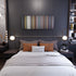 Bedroom interior with Wisin-Escapate-Conmigo Frome on the wall