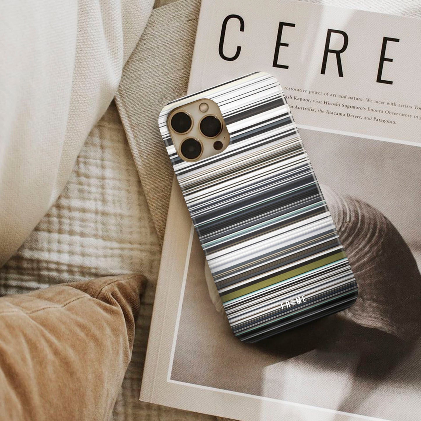 will.i.am - scream & shout Frome phone case next to interior items