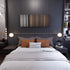 Bedroom interior with Wisin-Adrenalina Frome on the wall