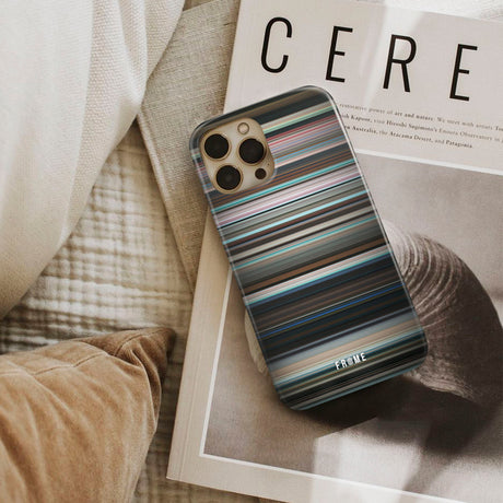 aftersun Frome phone case next to interior items