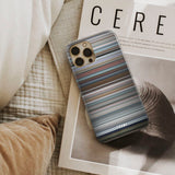 free_guy Frome phone case next to interior items