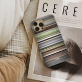 persuasion Frome phone case next to interior items