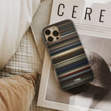 saltburn Frome phone case next to interior items