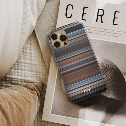 a ghost story Frome phone case next to interior items