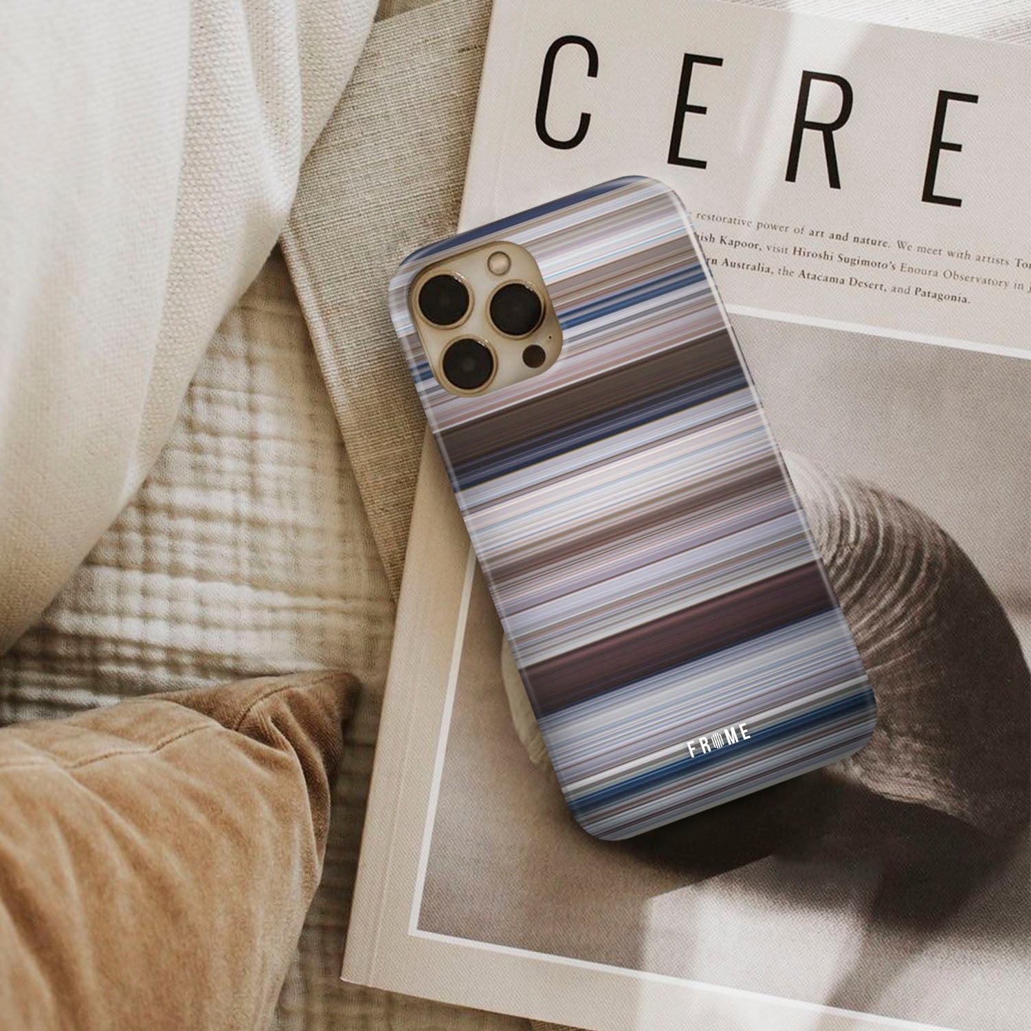 jaws Frome phone case next to interior items