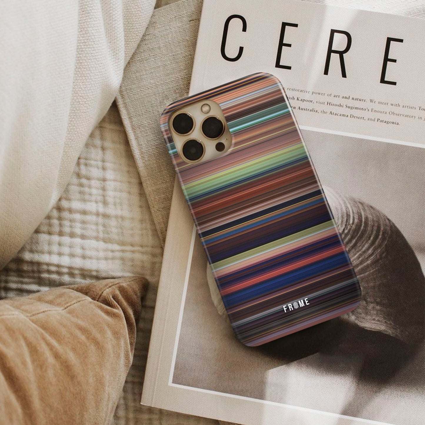 tangled Frome phone case next to interior items