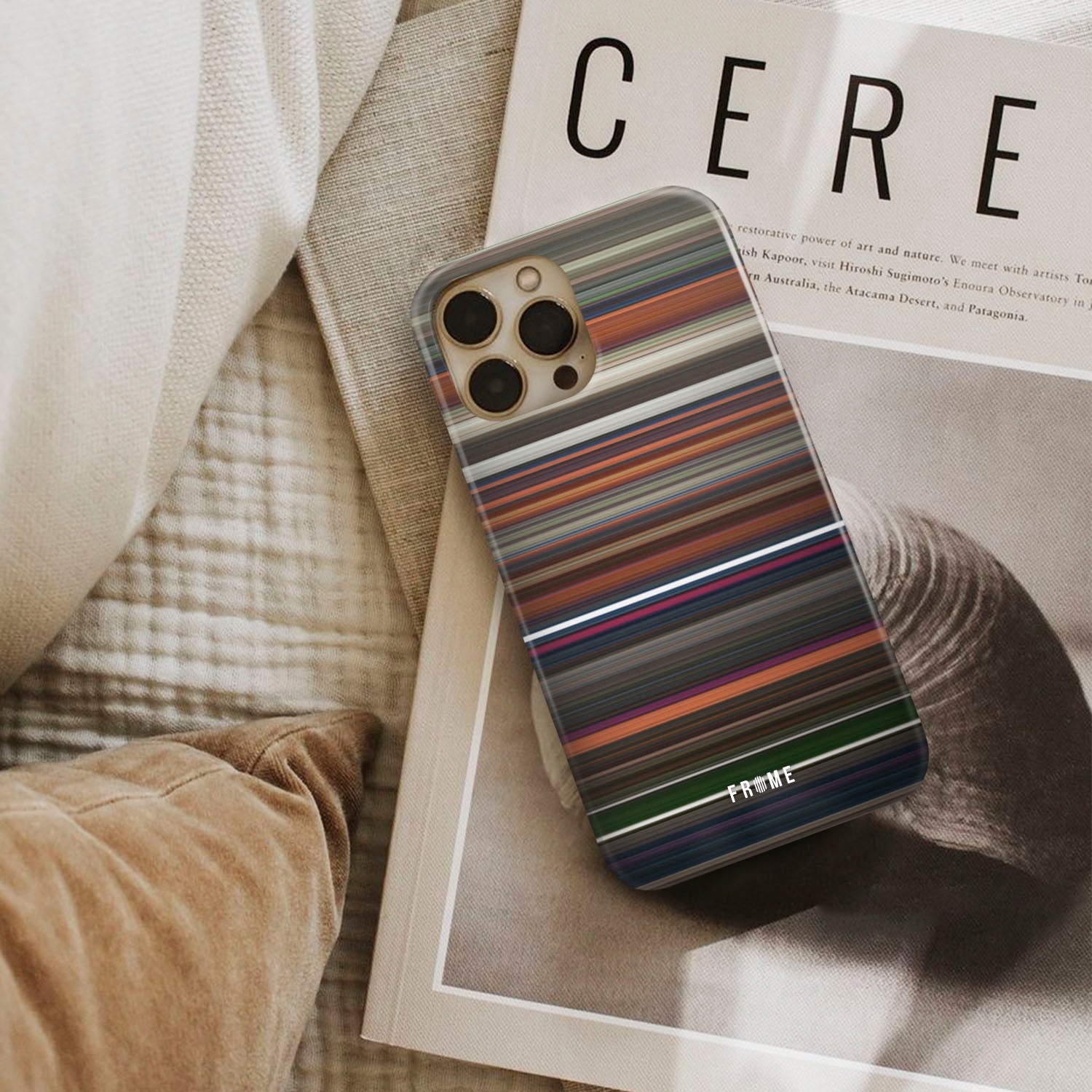 coraline Frome phone case next to interior items