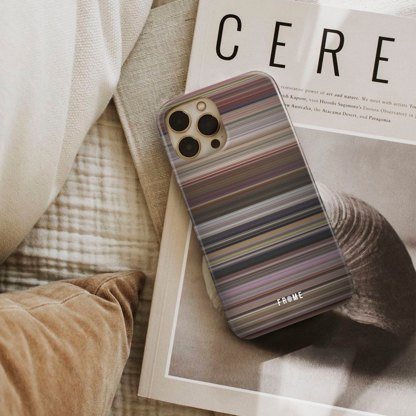 13 going on 30 Frome phone case next to interior items