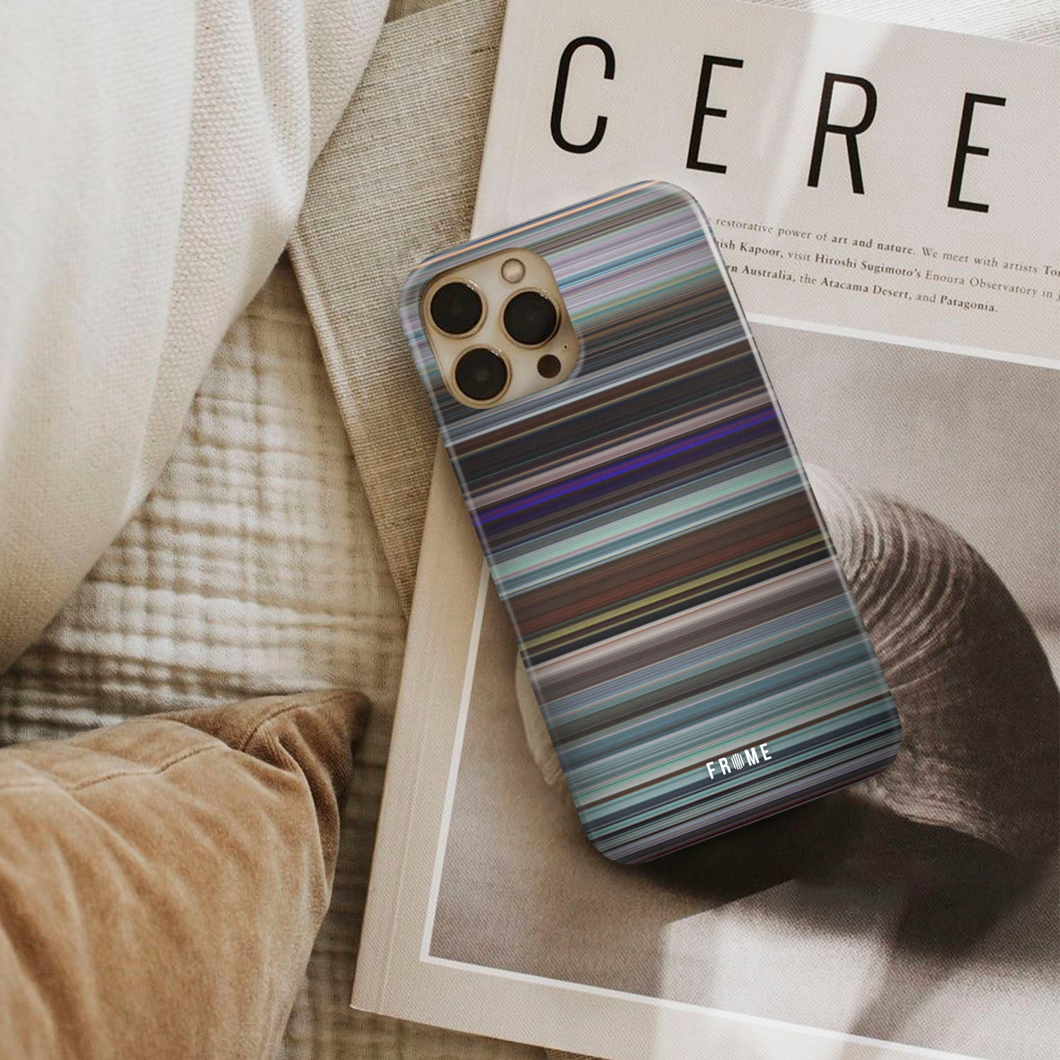 uncut gems Frome phone case next to interior items