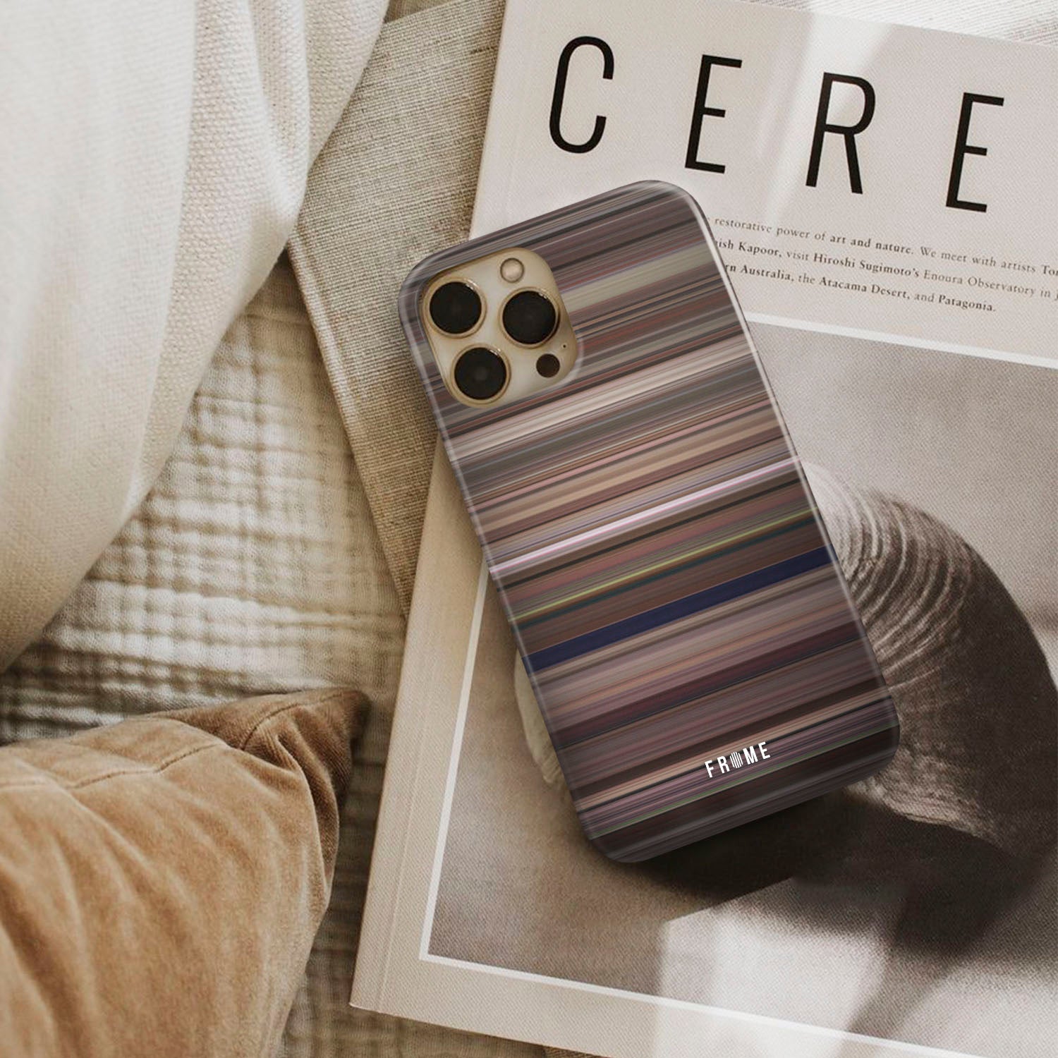 tootsie Frome phone case next to interior items