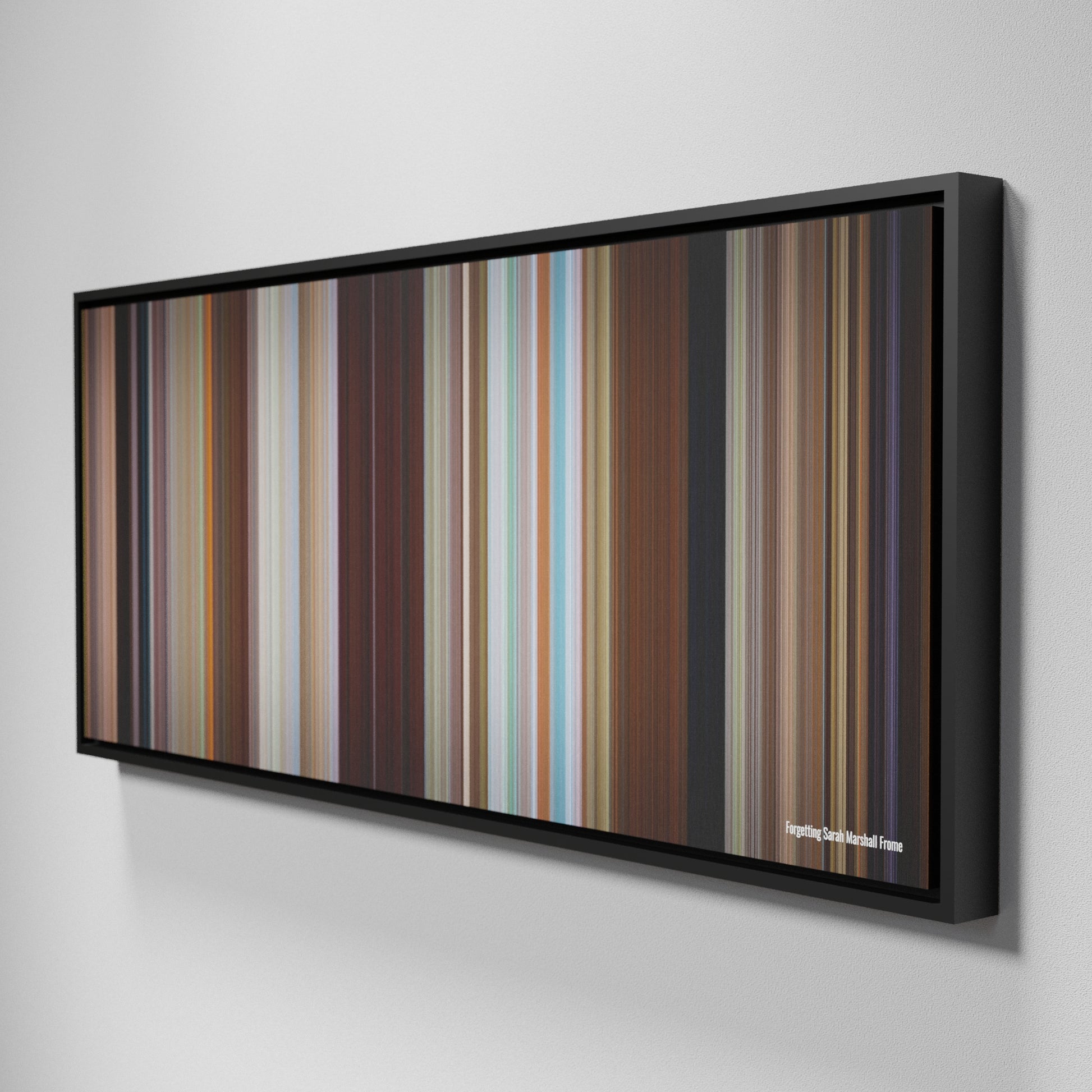 Side view of Framed Buff's of Forgetting Sarah Marshall Frome on the wall