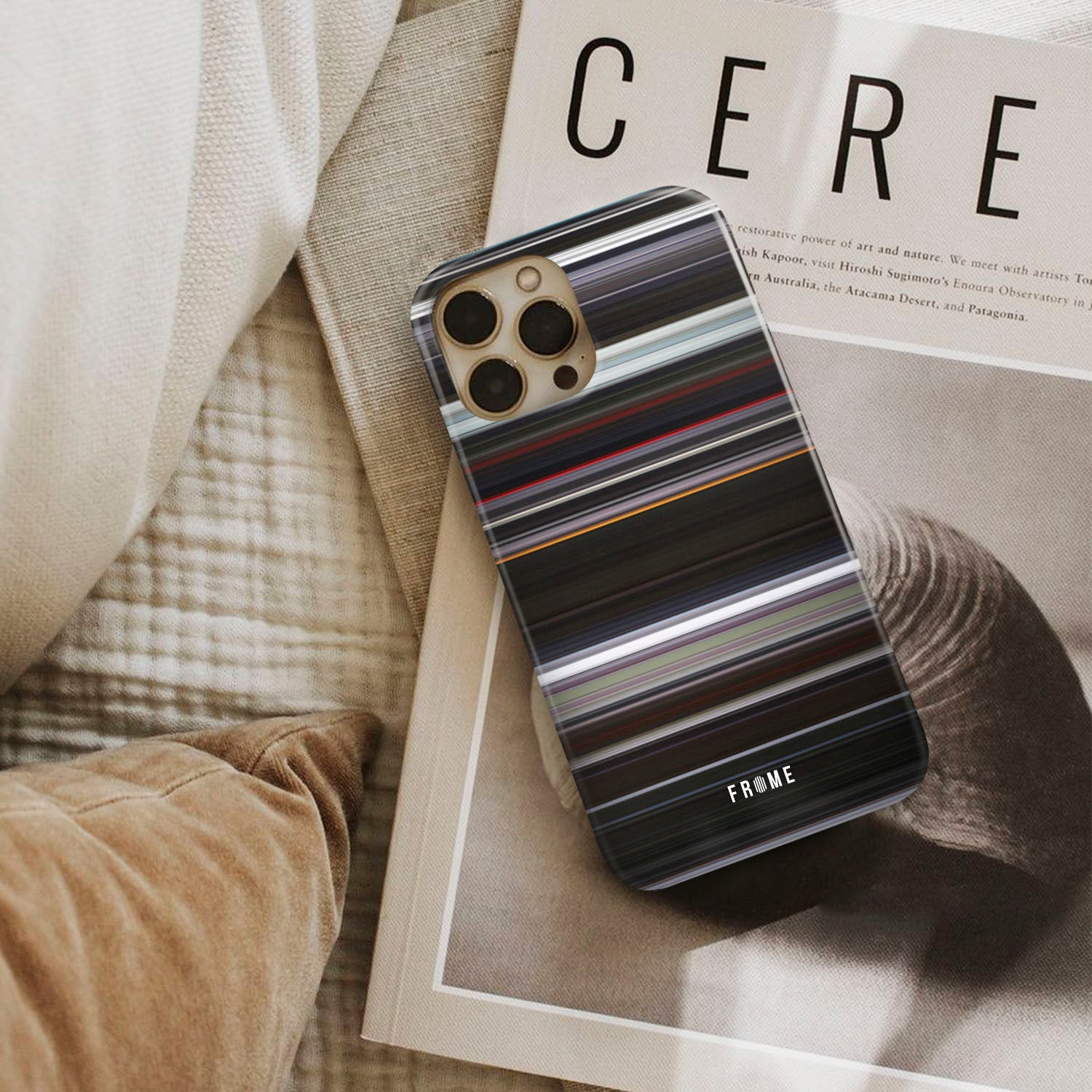 under the skin Frome phone case next to interior items