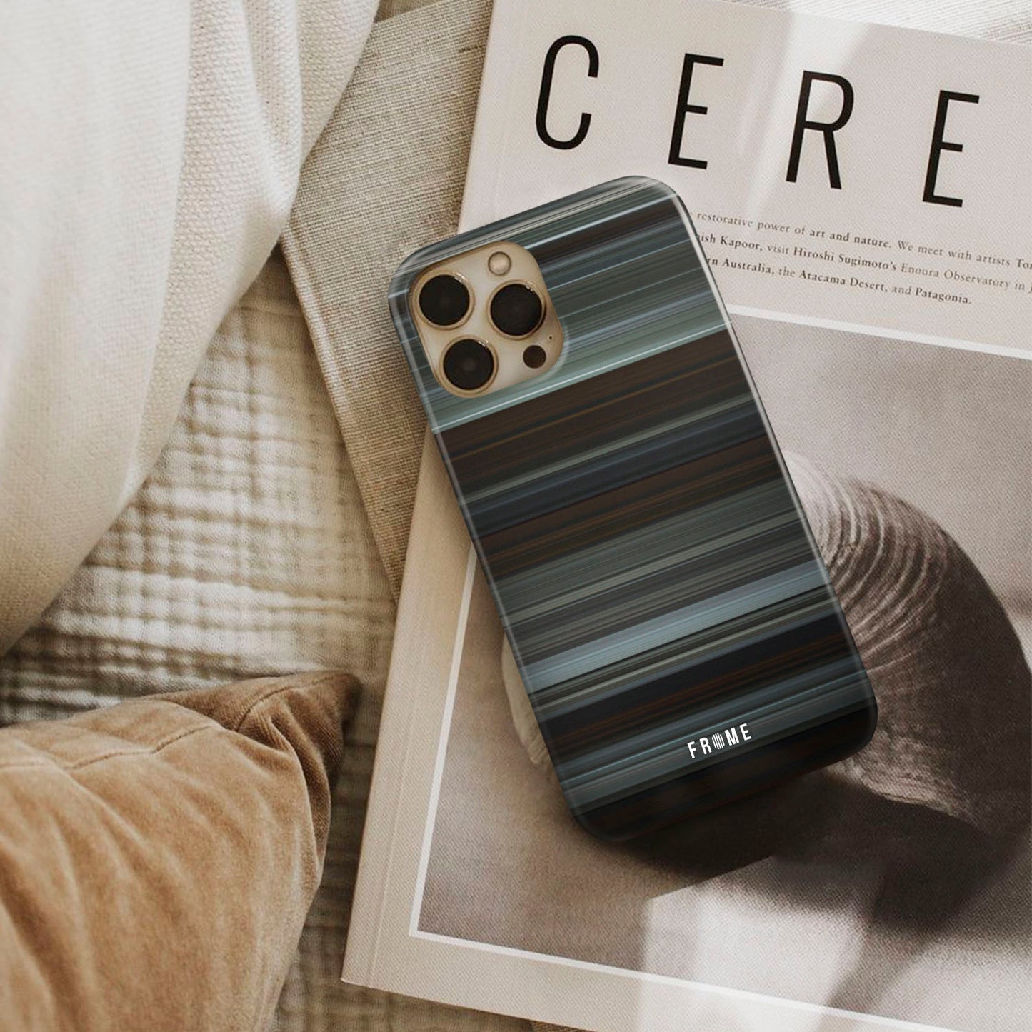 the witch Frome phone case next to interior items