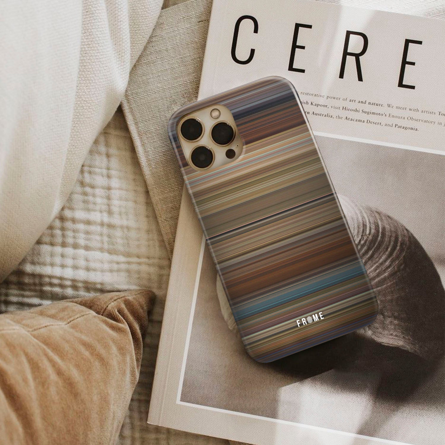 wanderlust Frome phone case next to interior items