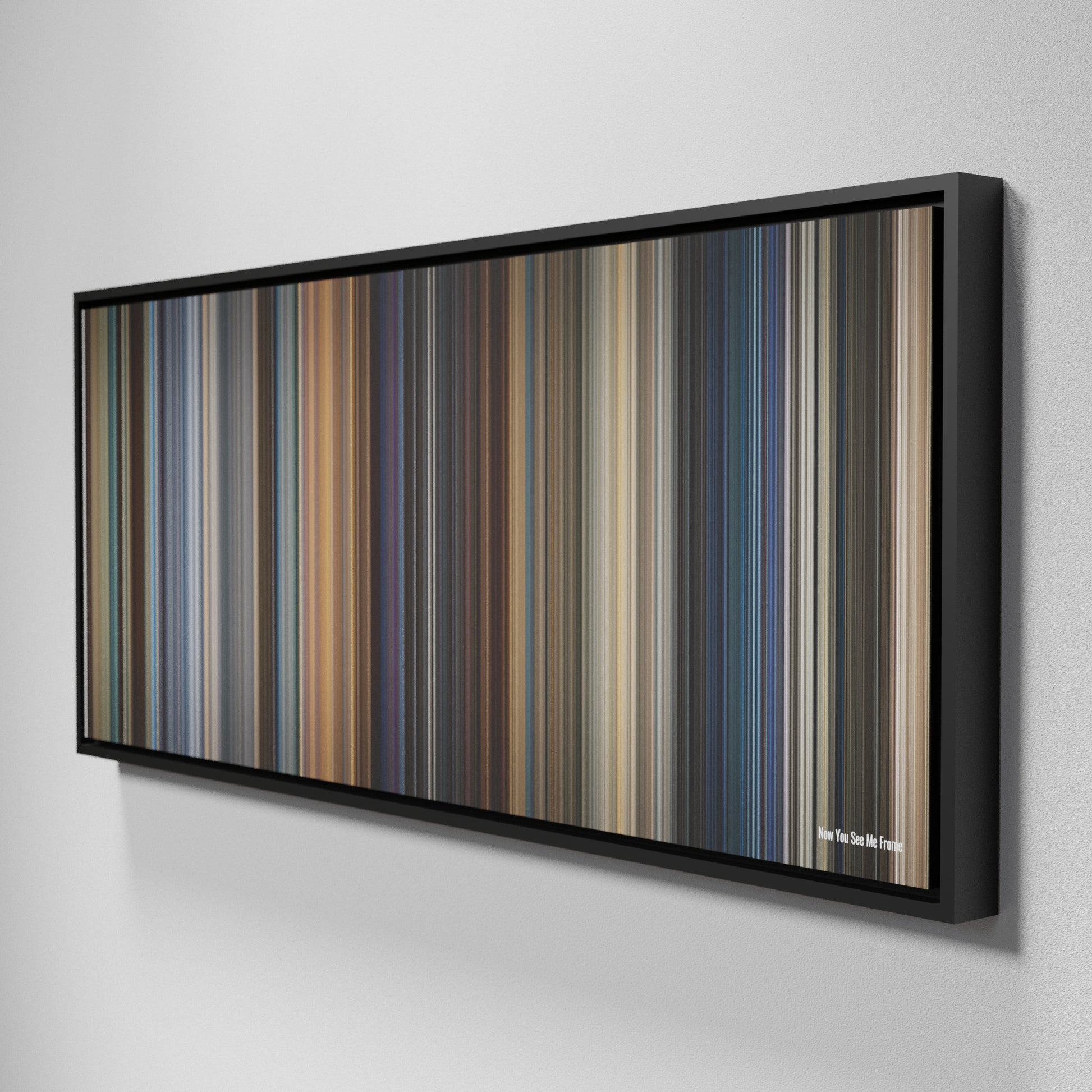 Side view of Framed Buff's of Now You See Me Frome on the wall