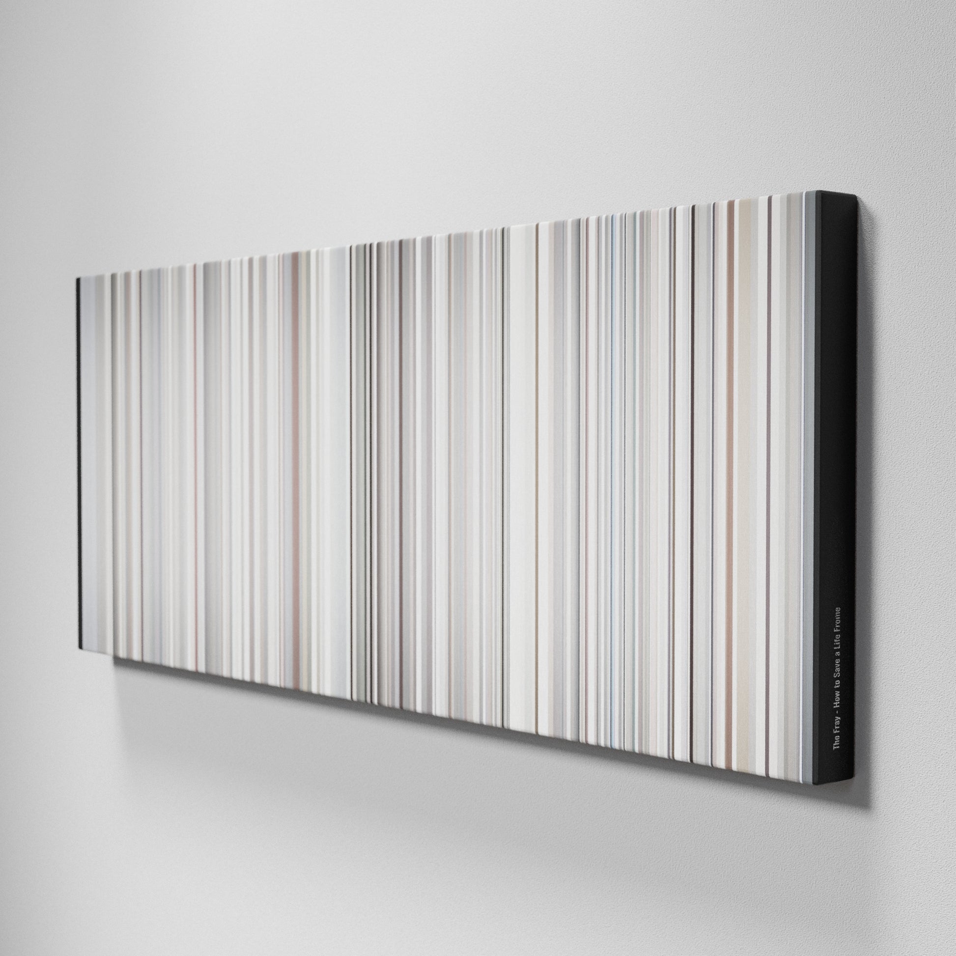 Side view of Buff's of The Fray - How to Save a Life Frome on the wall