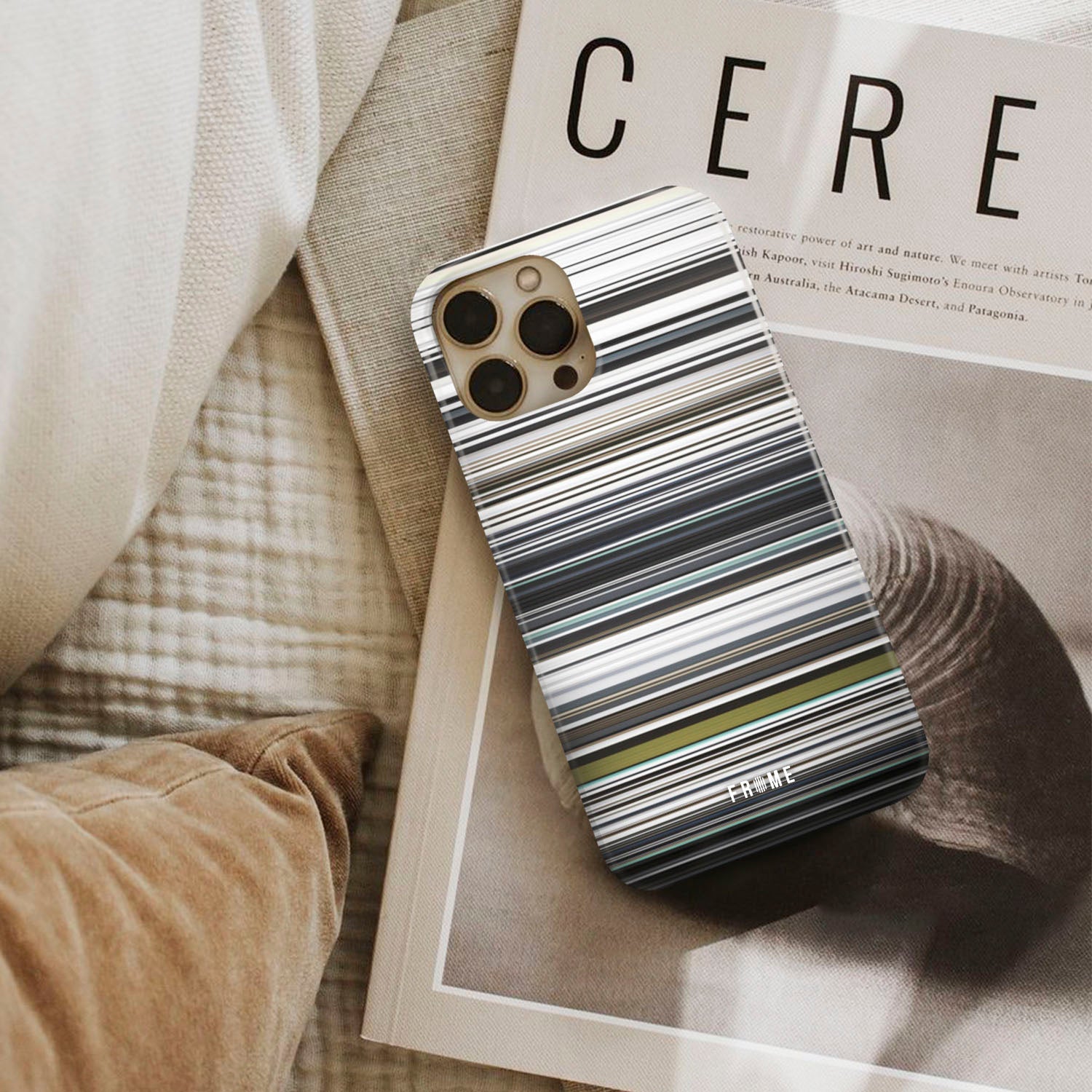 will.i.am - scream & shout Frome phone case next to interior items