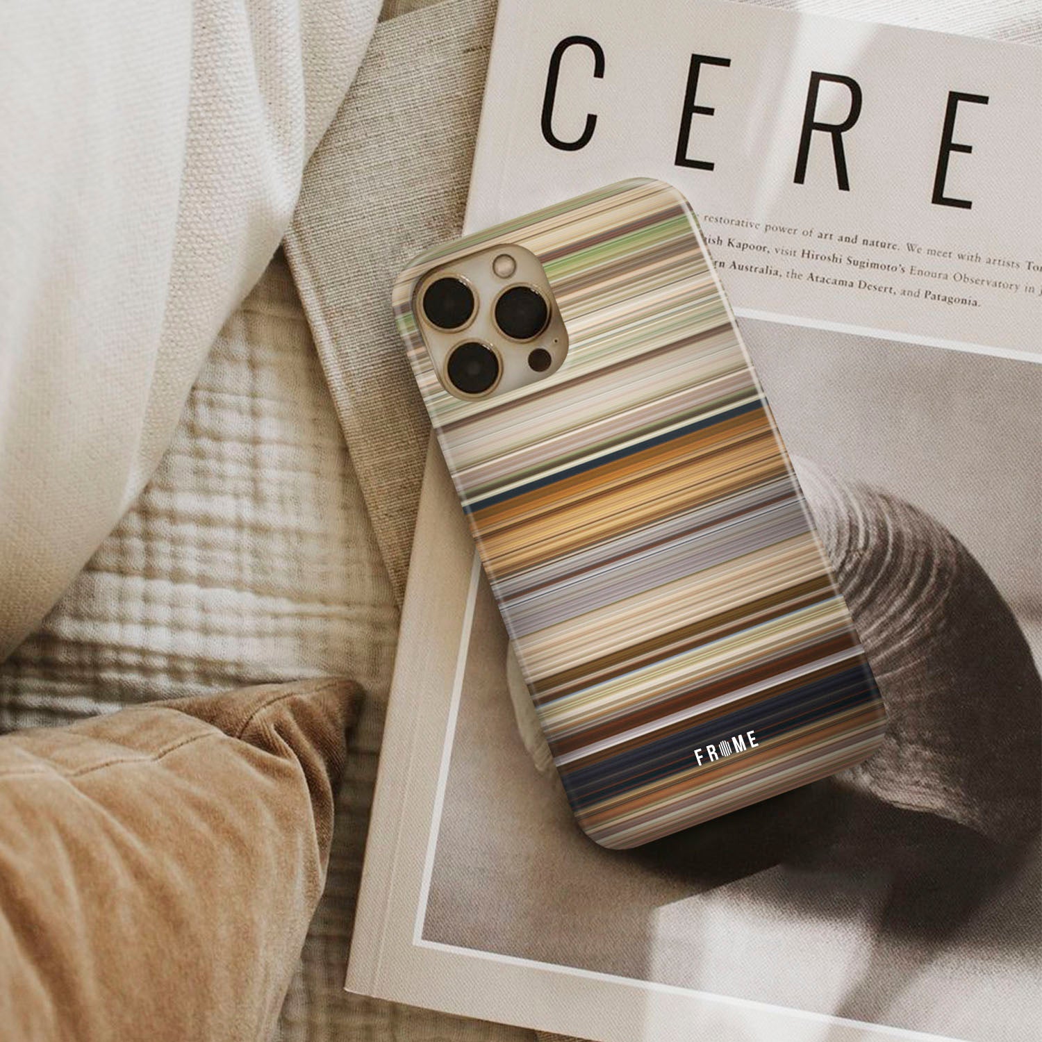 rrr Frome phone case next to interior items