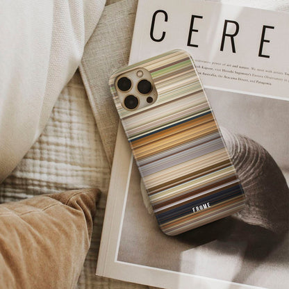 rrr Frome phone case next to interior items